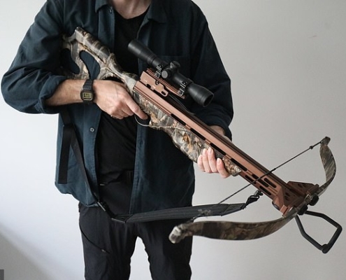 A reporter holds a £200 crossbow purchased from Phoenix Archery in Burnley, where questions were asked but the weapon nevertheless bought within minutes