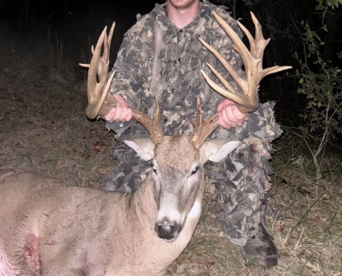 An Oklahoma hunter with a big buck with lots of points